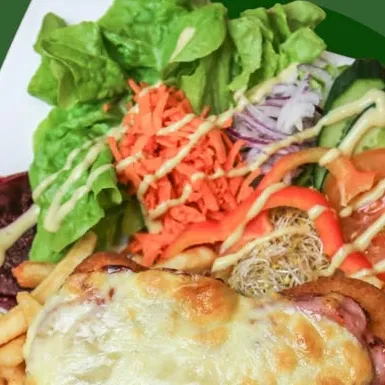 Chicken schnitzel parmigiana with chips and garden salad at Elly Cafe